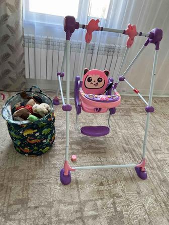 Детские качели и мешок игрушки все вместе