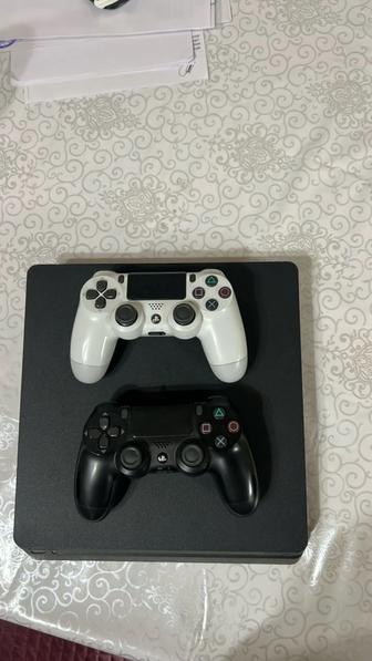 продам игровую приставку,sony playstation 4 slim 1 tb,2 джойстика,пару игр