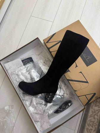 Продам сапоги новые