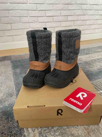 Продам сапоги Reima
