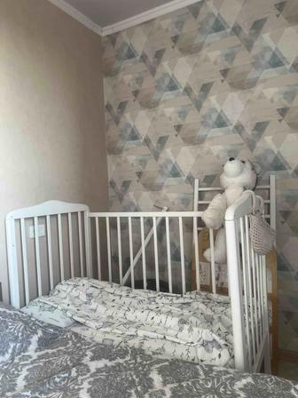 Продам детскую кроватку Наша Мама на колесиках