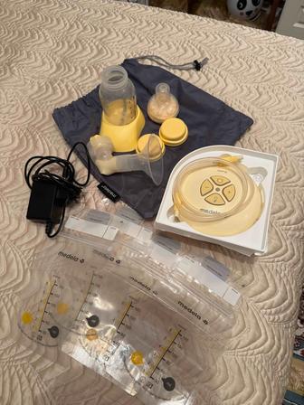 Молокоотсос Medela