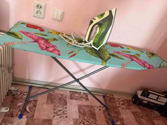 Утюг и гладильная доска