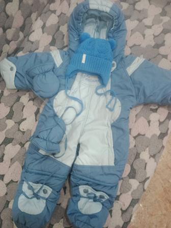 Продам комбинезон зима на рост 68 вместе с шапочкой б.у