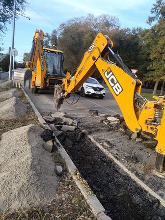 Услуги экскаватора-погрузчика три в одном