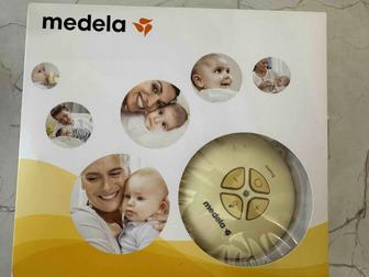 Молокоотсос Medela