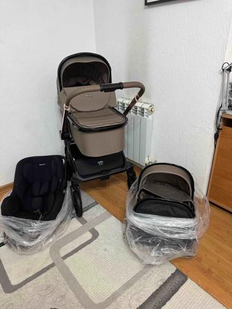 Kidilo Коляска 3в1. В комплекте рюкзак, дождевик, сетка от насекомых.