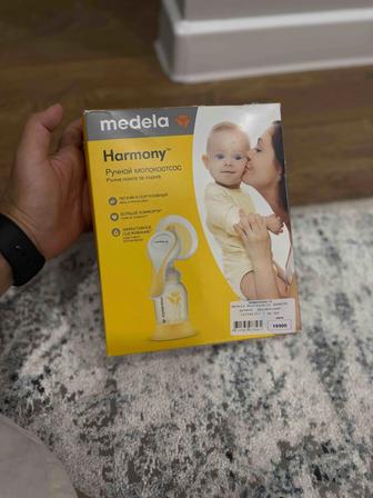 Продам ручной молокоотсос medela новый