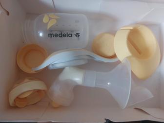 Молокоотсос Medela