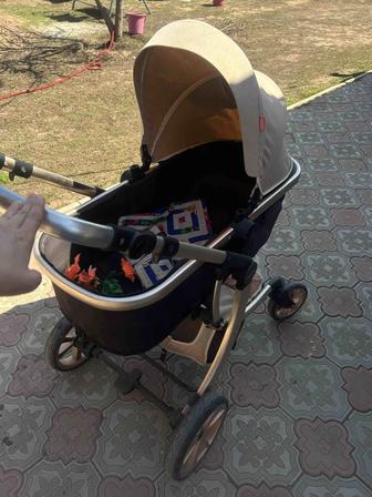 Продам детскую каляску и ходунки