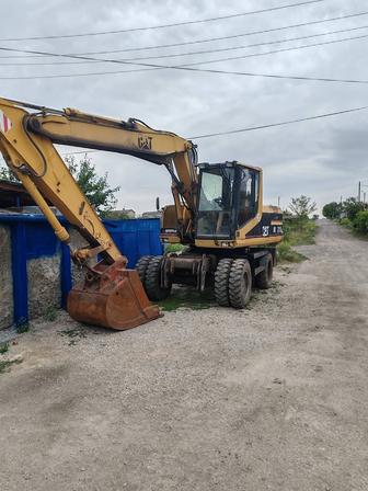 Услуги колёсного Экскаватора САТ
