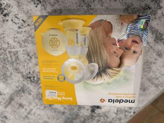 Продам электрический молокоотсос medela