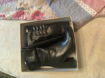 Продам сапоги новые