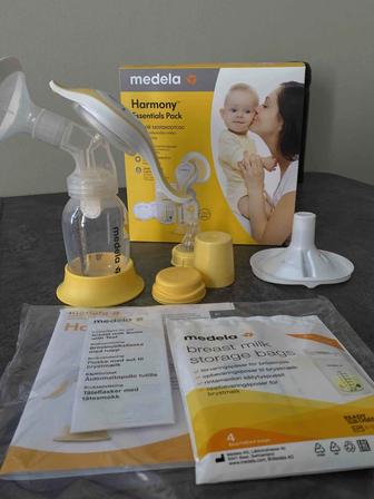 Продаем ручной молокоотсос Medela. Пакет для стерилизации в подарок.