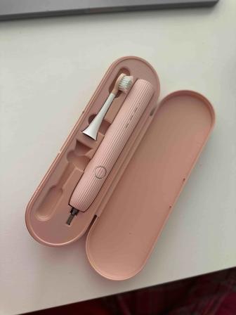 Электрическая зубная щетка