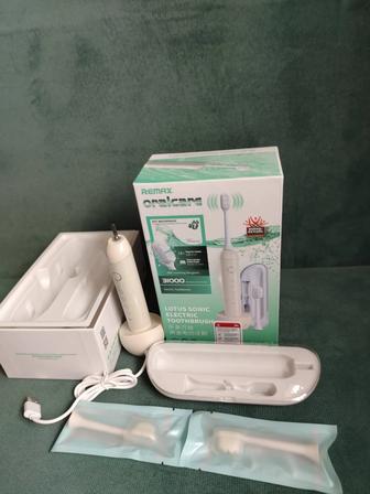 Электрическая зубная щетка