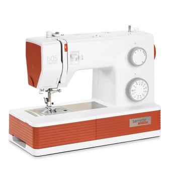 Недорого. Продам швейную машину Bernina Bernette B05 Crafter бело/оранжевый