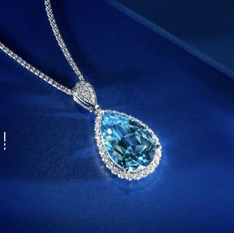 Изысканный ювелирный комплект из серебра с натуральным голубым топазом