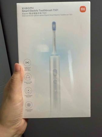 Электрическая зубная щетка