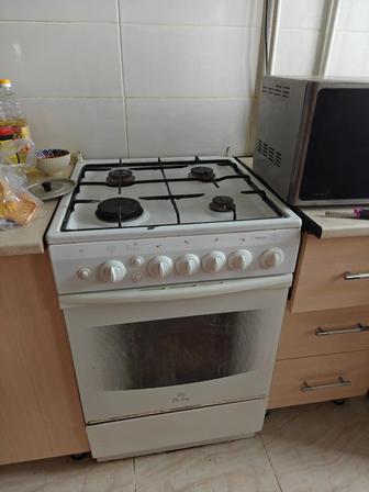 Газовая плита DeLuxe с духовкой хорошее состояние