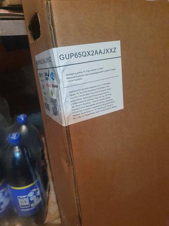 Новый телевизор Samsung GUP65QX2AAJXXZ продается в коробке